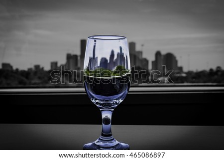 three houston skylines, one glass, with a gray background
