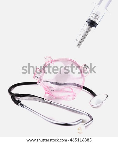 Piggy piggy bank is empty with stethoscope and injection needle , the idea reflects the financial condition is not good enough jam savings.