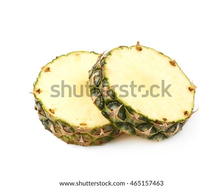 Two pineapple cross-section slices isolated over the white background