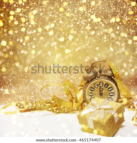 Christmas decorations and gift box on sparkling background