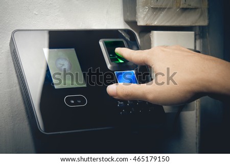 The fingerprint scanner to record working time. Royalty-Free Stock Photo #465179150