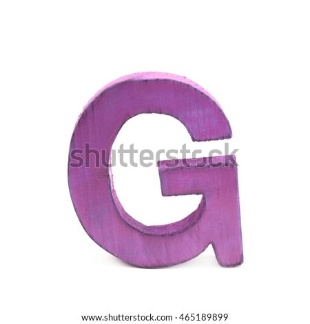 Single sawn wooden letter G symbol coated with paint isolated over the white background