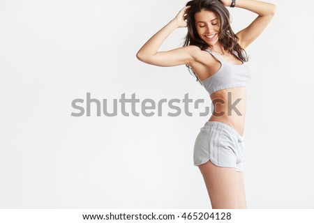 Smiling woman with beautiful body after diet, isolated on white with copyspace for text Royalty-Free Stock Photo #465204128