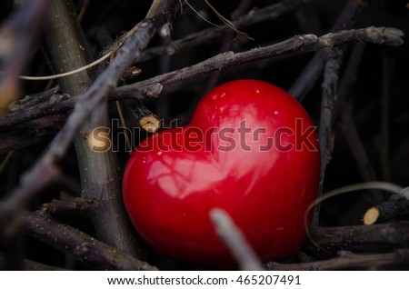 Valentine day. Red heart on the dark boards. Valentine's Day. Heart pendant. Red heart