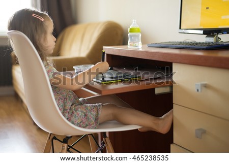 IT toddler girl using digital tablet for drawing and learning shapes