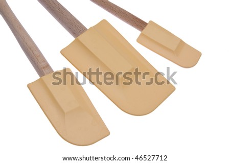 Trio of cream colored spatulas isolated on white with a clipping path ready for the next baking project.