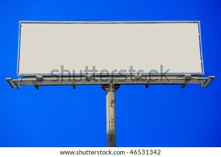 Large blank commercial billboard against cloudy sky