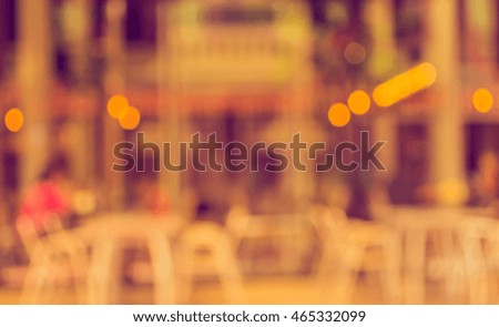 Abstract blurred image of outdoor cafe on day time for background usage . (vintage tone)