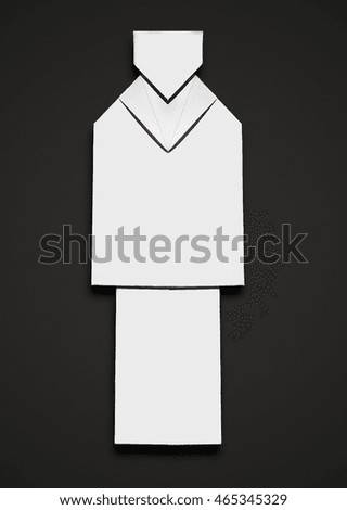 Origami man in a suit on black background