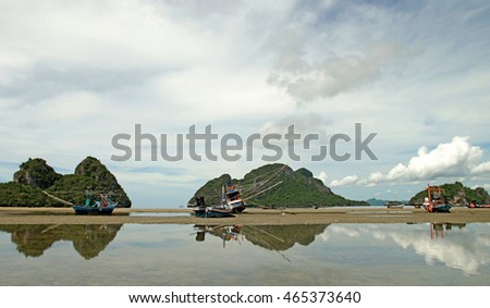 fishing boat on the beach with beautiful sky background