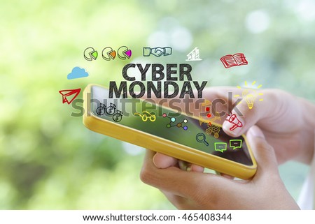 hand holding a smartphone with CYBER MONDAY concept , business concept