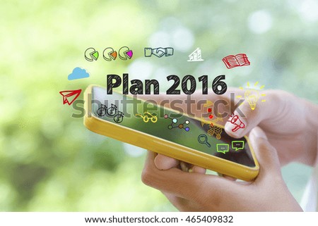 hand holding a smartphone with PLAN 2016 concept , business concept