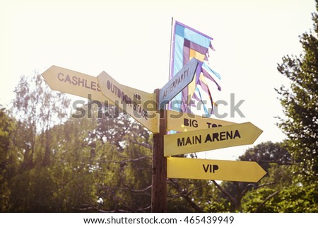 Close Up Of Signpost At Outdoor Music Festival