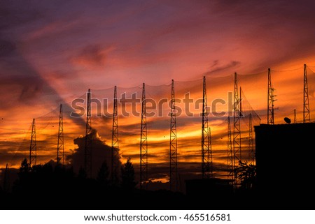 Golf field in silhouette image at sun set