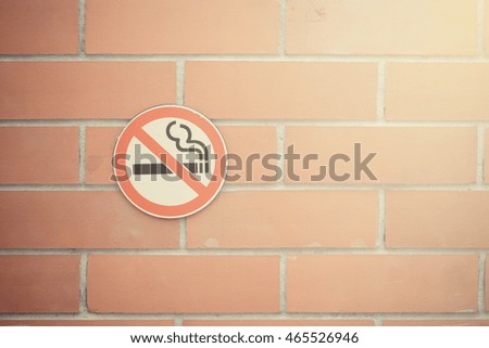 No smoking sign on red brick background