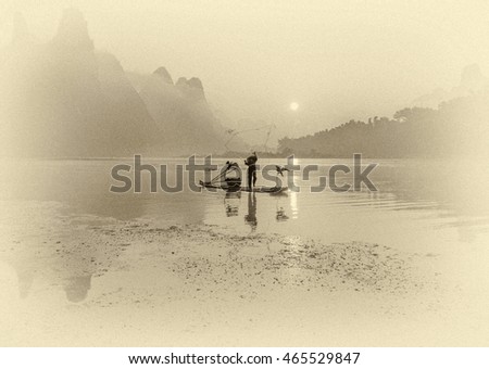 Cormorant fisherman throws a net with ancient bamboo boats at sunrise - Xingping, China (stylized retro).