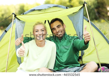 Picture showing group of friends camping in forest