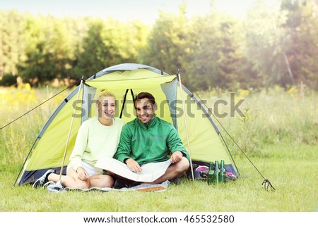 Picture showing couple camping in forest