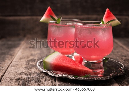 Watermelon drink in glasses with slices of watermelon mint and lemon, vintage background ,soft focus