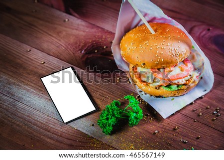 hamburger on a wooden background, fast food restaurant