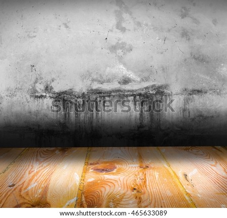 Old concrete wall and wooden floor interior. Textures useful as background