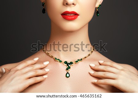 Elegant fashionable woman with jewelry. Beautiful woman with emerald necklace. Young beauty model with emerald pendant. Jewellery and accessories. Fashion and beauty salon. Perfect lip makeup Royalty-Free Stock Photo #465635162
