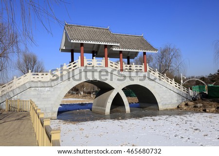double arch stone bridge in a park, china