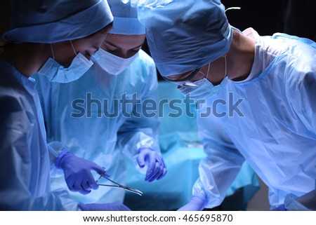 Team surgeon at work in operating room