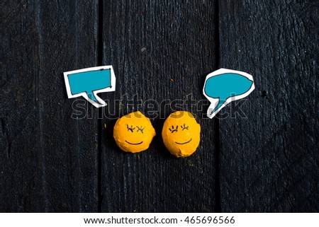 Series of two smile face talking on vintage table with talking box and free space. Chat bubbles are colored in emerald.