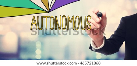 Businessman drawing Autonomous concept on blurred abstract background 