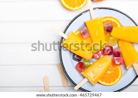 Homemade orange ice cream on a stick