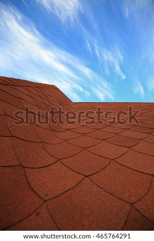 macro background texture cirrus clouds and tiled roof on a blue sky on a sunny day