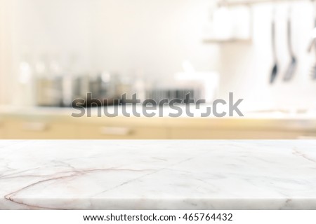 Marble stone table top (kitchen island) on blur kitchen interior background - can be used for display or montage you products Royalty-Free Stock Photo #465764432