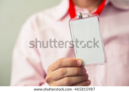 Man holding Identification white blank plastic id card. Royalty-Free Stock Photo #465815987