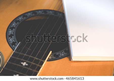 Concept of music, Notebook on guitar for writing music,Vintage retro picture style