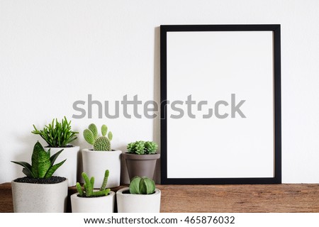mock up photo frame with cactus pot. home decor