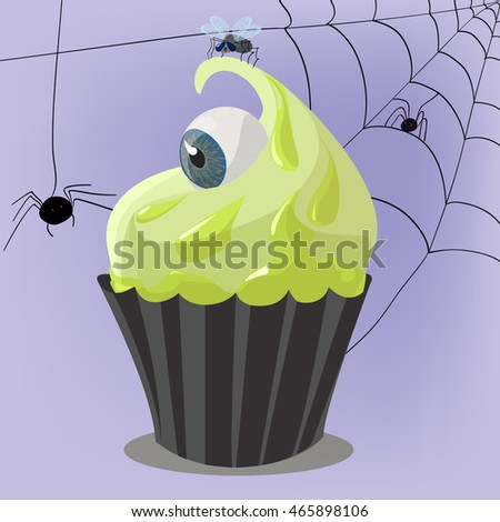 cake with an eye and a spider on Halloween