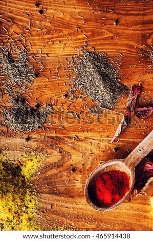Spices on a wooden background.