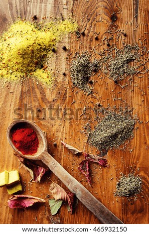 Spices on a wooden background.