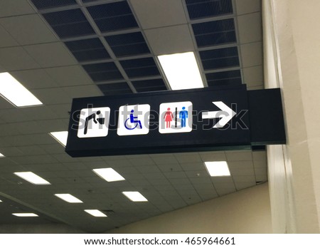 Toilets and drinking water signs in departure hall 