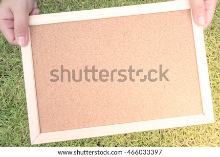 Blank cork board with wood frame for background