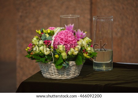 Beautiful fresh flowers in the basket outside