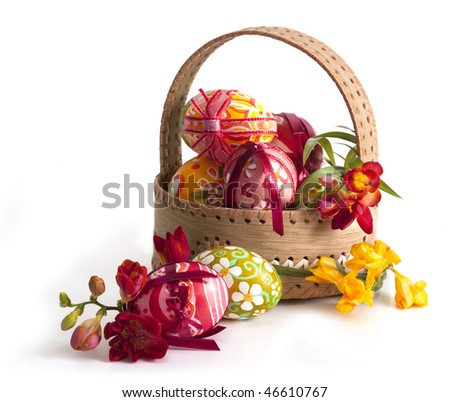  Basket full of Easter eggs and flower Royalty-Free Stock Photo #46610767