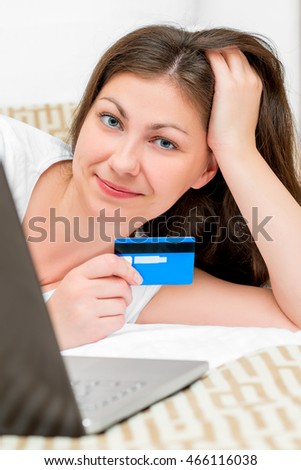 Vertical picture of a girl with a credit card