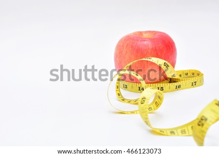 Red apple bind with tape measure for background lose weight 