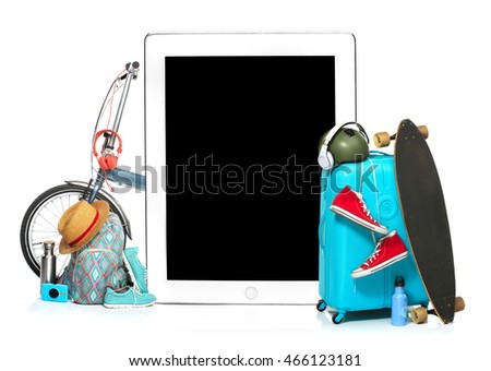 The blue suitcase, sneakers, clothing, hat, and laotop on white background. The travel, tourism  holidays concept