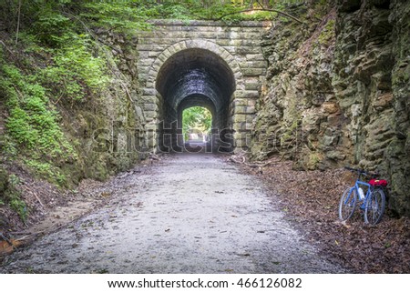 MKT tunnel and bike  on Katy Trail at Rocheport, Missouri. The Katy Trail is 237 mile bike trail stretching across most of the state of Missouri converted from an old railroad. Royalty-Free Stock Photo #466126082