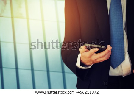 Businessman holding phone