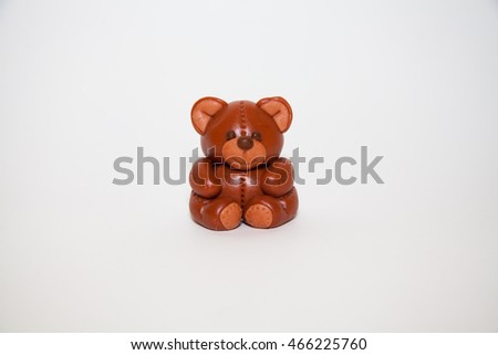 Plasticine chocolate happy bear with gift holiday boxes on a white background