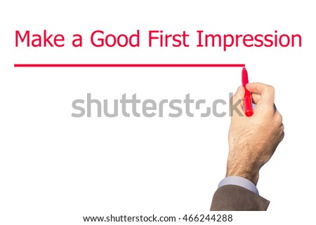 Man Hand writing Make a Good First Impression with marker on visual screen. Isolated on background. Business, technology, internet concept. Stock Photo